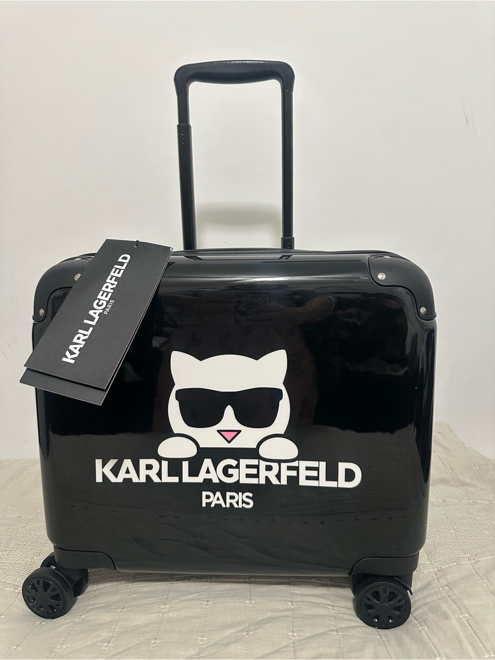 Karl Lagerfeld Kids Black Glossy Rolling Suitcase with White Cat Logo